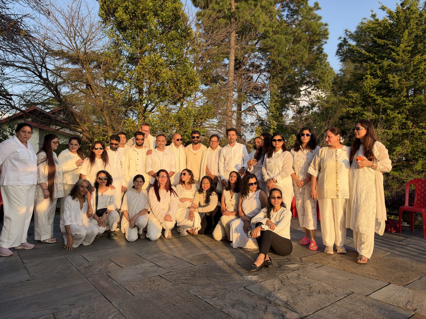 The retreat circle together, dressed in white